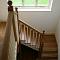 Traditional oak cut string staircase with painted spindles (view1)